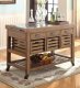 100307 Kitchen Island in Medium Brown by Coaster