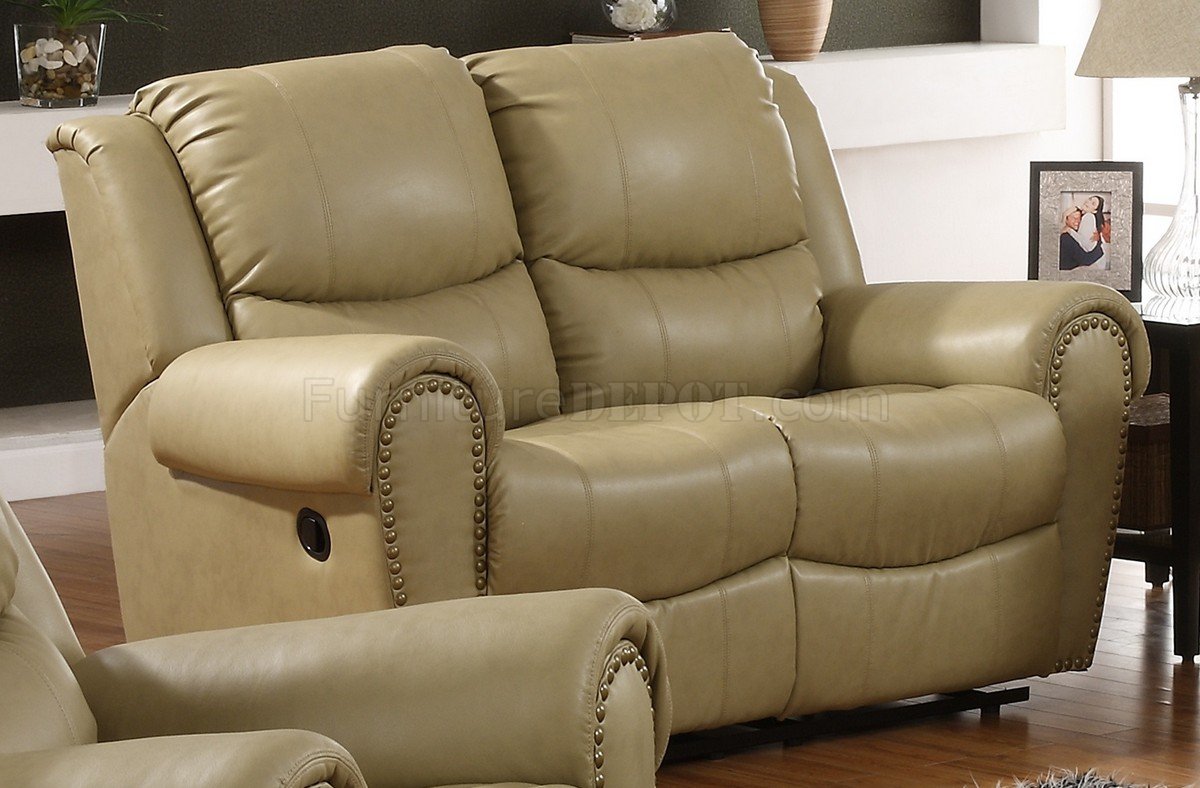 cream colored leather reclining sofa