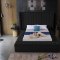 Kiki Upholstered Bed in Black Velvet Fabric by Meridian